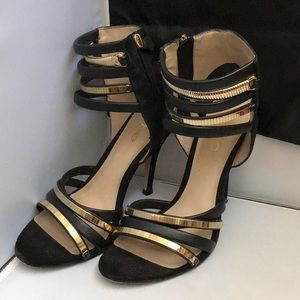 Bebe Black and Gold Ankle Strap Heels Size 8